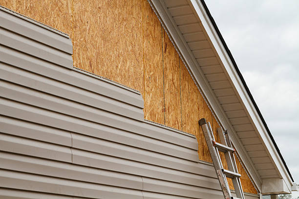 Professional Siding technician working in White Hall, MD
